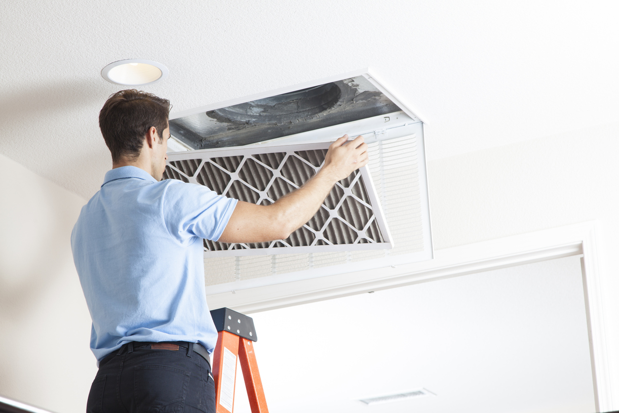 Technician Completing HVAC Repairs